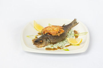 Fried fish on white plate