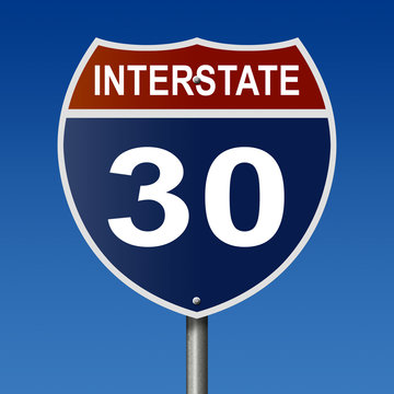 Sign for Interstate 30, part of the National Highway System, which travels between Texas and Arkansas