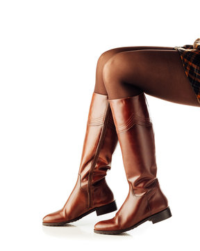 Woman Legs Wearing Brown Leather High Boots