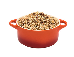 Raw brown rice in ceramic pot
