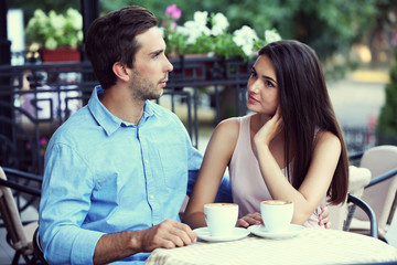 Young couple in street cafe