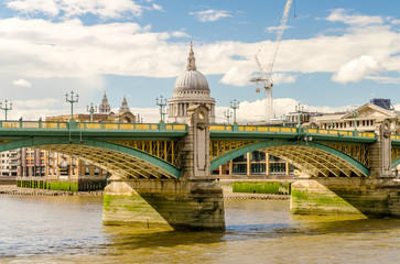 Naklejka premium View of St Paul Cathedral over Southwark Bridge in London