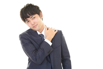 肩こりに悩む男性