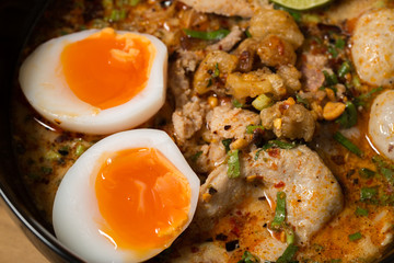 Thai noodle soup in a bowl taste spicy noodle soup and boiled eg