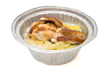 round shape lunch box of chicken slices on white with clipping path