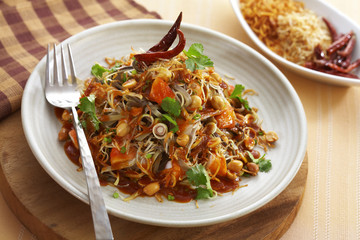 close up thai spicy mixed vegetable salad in ceramic dish