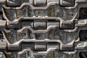 Steel rusty caterpillar from the Soviet military tank. Background