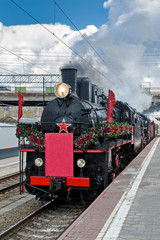 Old trains, dedicated to the victory of the Soviet people in the Great Patriotic War arrives at the station.