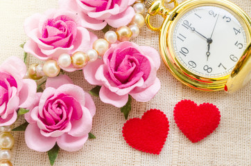 Red heart and pink rose with gold pocket watch.