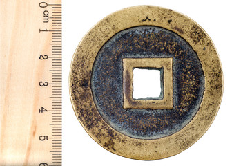 Ancient Chinese bronze coin with a square hole. Ming dynasty. Obverse. Isolated on white