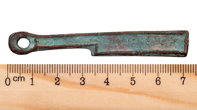 Ancient bronze coin in the form of knife Zhou Dynasty. China. Isolated on white