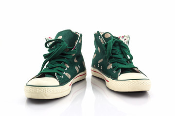 Green polka dot canvas shoe.