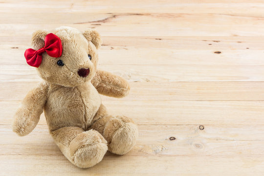 Classic teddy bear red bow toy.