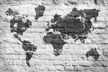 White wall and a picture map of the world