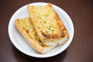 garlic bread on white bowl