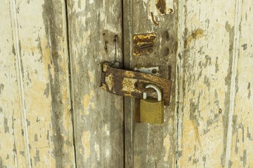 Old lock on the door - lock on the door of an old house