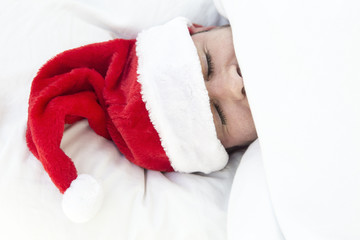 man sleeping with santa hat