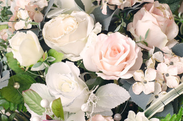 Artificial orange and white rose flowers bouquet
