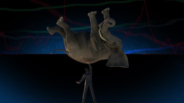 Businessman picks up the elephant as a symbol of dostizhenia business purposes, on the background of business charts