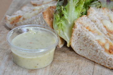 whole wheat bread filling tuna mayonnaise and vegetable with dipping sour sauce