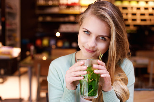 Attractive Young Woman Drinking Mint Tea