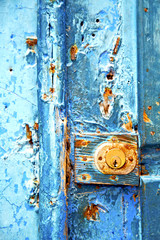 rusty metal     nail dirty stripped paint in the   knocker
