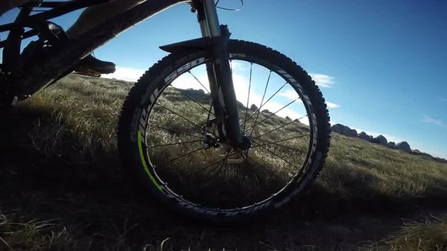 Trail mountain biking side shot with sun at the background