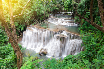 Naklejka na ściany i meble Deep forest waterfall in autumn scene at Huay Mae Kamin waterfall, Kanchanaburi, Thailand