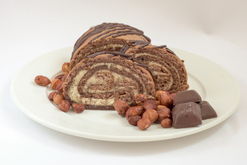Brown cake with chocolate and nuts composition