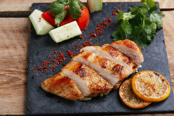 roast chicken breast with lemon and vegetables