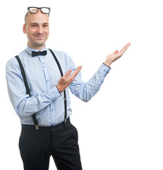 guy with suspenders and bow-tie showing copy space