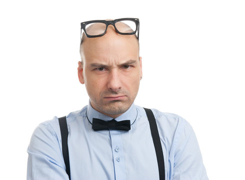 angry man with suspenders and bow-tie