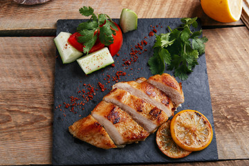 roast chicken breast with lemon and vegetables