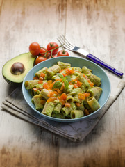 pasta with avocado and tomatoes, selective focus