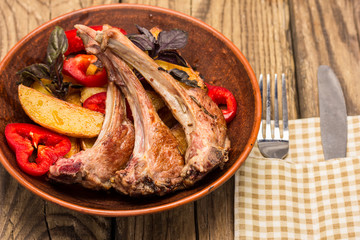 roasted ribs of lamb on ceramic plate