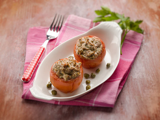 stuffed tomatoes with tuna and capers, selective focus