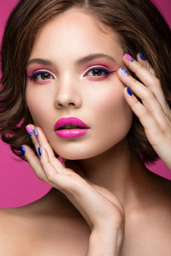 Beautiful model girl with bright pink makeup and colored  nail polish. Beauty face. Short colorful nails