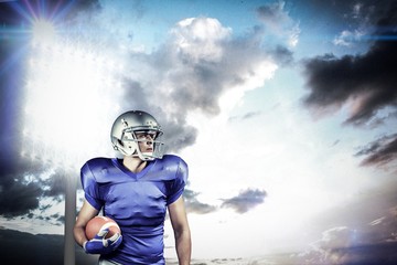 Composite image of american football player looking away
