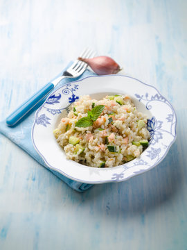 risotto with fresh salmon and zucchinis, selective focus