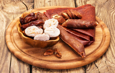 dried fruits on wooden plate