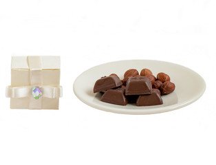 Chocolate with nuts and a gift box composition
