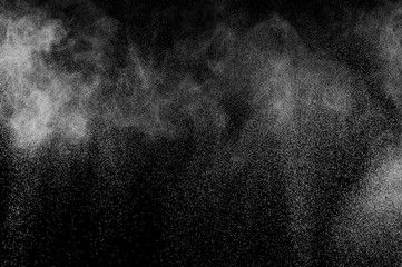 abstract white dust explosion  on a black background. abstract white powder. design elements. abstract texture.