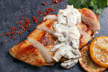 roast chicken breast with mushroom sauce and lemon 