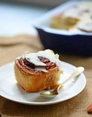 Fresh cinnamom rolls on plate closeup