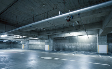 Empty space car park interior at night