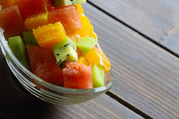 Fresh fruits salad on wooden table