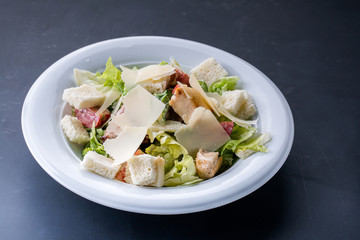 Healthy Grilled Chicken Caesar Salad with Cheese and Croutons on