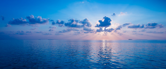 Naklejka na ściany i meble Spectacular sunset over the ocean. Maldives