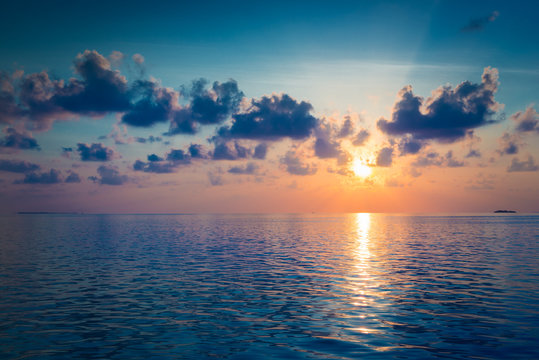 Fototapeta Spectacular sunset over the ocean. Maldives