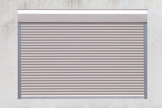 White metal roller window shutter and concrete wall background